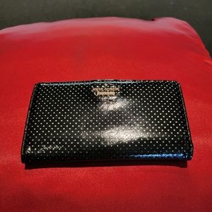 Kate Spade patent black and white polka dot wallet.